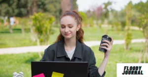 Young woman researching best online degrees on laptop outdoors with coffee, representing flexible online education options