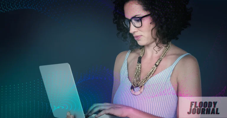 Woman with curly hair and glasses working on laptop with digital effects, representing Izabella2237 online persona and digital community engagement
