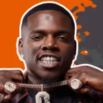 Big Boogie showing his CMG chain and jewelry representing his net worth success